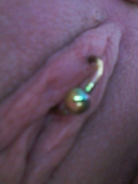 A Vertical Clitoral Hood (VCH) Piercing with Ring